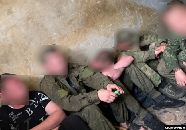 Russian mobilized soldiers are kept in a penalty room known as "the pit" as a punishment for complaints or insubordination, in Korenevo, Ukraine's Kursk region, in July.