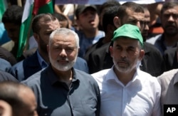 یحیی سنوار در کنار اسماعیل هنیه در یک تجمع سیاسی در غزه، ۲۰۱۹