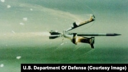 A sabot tank penetrator round separating in flight
