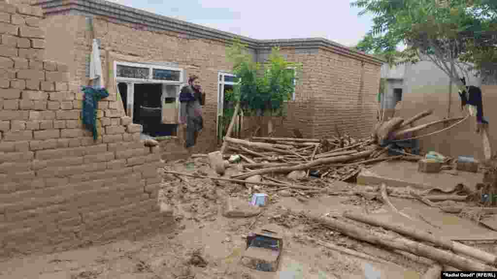 An Afghan man looks at the damage to his home on May 12 following flash flooding that has inundated northern Afghanistan&#39;s&nbsp;Baghlan Province, The latest wave of flooding from heavy seasonal rains has left more than 300 people dead, many more injured, and more than 1,000 homes destroyed, according to UN World Food Program (WFP) officials. &nbsp;