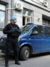 Bosnia-Herzegovina - Police officer and police car in front of Canton Sarajevo Police office, Sarajevo, 9May2023