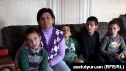 Armenia - Karabakh refugee Meline Khachatrian and her children, October 12, 2023