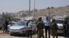 Forcat izraelite pranë vendit ku u vra një grua në Hebron, 21 gusht 2023.