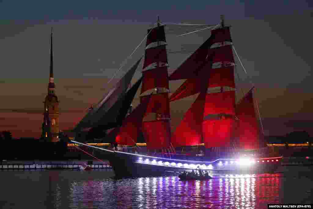 The frigate Rossia (Russia) with scarlet sails floats on the Neva River during a rehearsal of the Scarlet Sails celebration in St. Petersburg, Russia.