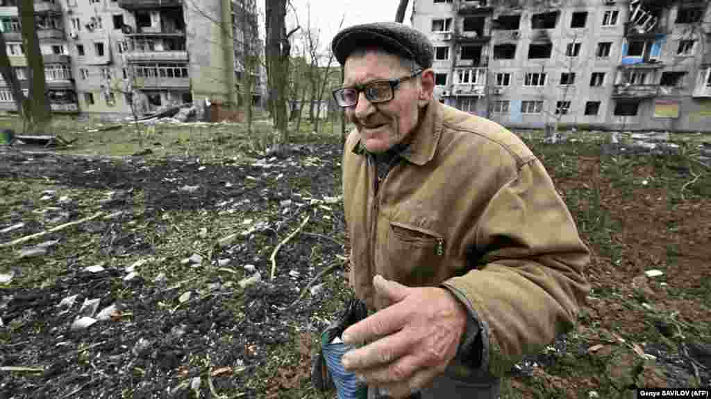 Grozdov is one of the residents who chose to remain in the burnt-out shell of the former town.&nbsp;AFP journalists first met him on April 4 (pictured) after they found him lying at the bottom of a crater. With his poor eyesight, he had fallen in while gathering food that had spilled out of his bag and was unable to climb out. &nbsp;