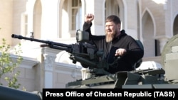 Kremlin-backed Chechen autocrat Ramzan Kadyrov takes a ride on an upgraded T-72 tank in Grozny in May 17.
