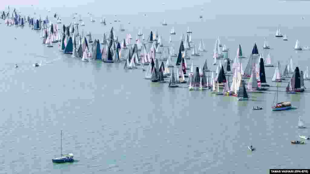 A drone shot shows participants starting the Blue Ribbon sailing race around Lake Balaton in Hungary.&nbsp;