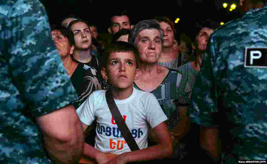 Demonstrators rally in Stepanakert to demand the reopening of a blockaded road linking the Nagorno-Karabakh region to Armenia and to decry crisis conditions in the region on July 25.