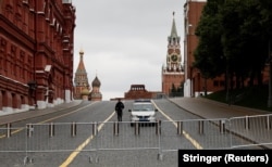 A police officer guards the closed Red Square in Moscow on June 24.