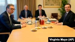 Serbian President Aleksandar Vucic (left) and Kosovo Prime Minister Albin Kurti (right) meet with European Union foreign policy chief Josep Borrell (2nd left) in Brussels on February 27.