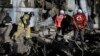 Рятувальники працюють на місці обстрілу в Запоріжжі, 2 березня 2023 року