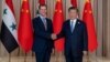 Chinese leader Xi Jinping shakes hands with ousted Syrian President Bashar al-Assad during a state visit to China in 2023. 