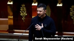 Ukrainian President Volodymyr Zelenskiy addresses lawmakers at France's National Assembly in Paris on June 7. 