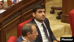 Armeina -- Opposition deputy Mher Sahakian (right) attends a session of the Armenian parliament, April 11, 2023.