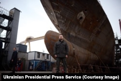 Ukrainian President Volodomyr Zelenskiy stands in front of a second corvette being constructed in Istanbul on March 8.