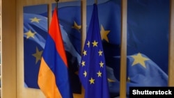 The flags of Armenia and the EU in the European Council building in Brussels (file photo)