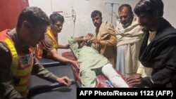 Rescue workers attend to an earthquake victim at a hospital in Swat in Khyber Pakhtunkhwa Province on March 22.