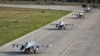 American F-16s taxi on the runway at the newly opened European F-16 Training Center in Borcea, Romania.