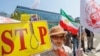 Iranian refugees rally against executions in Iran in front of the building of the Commissariat for Refugees in Brussels in June 2023.