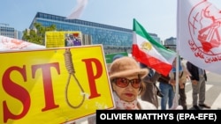 Iranian refugees rally against executions in Iran in front of the building of the Commissariat for Refugees in Brussels in June 2023.