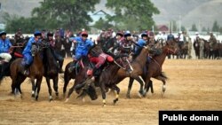 Participants take part in a kok-boru match in the President' Cup in Osh on August 31.