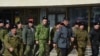 CRIMEA -- Representatives of pro-Russian paramilitary formations (Cossacks and "Crimea's Self-Defense") on the streets of Simferopol, Crimea, March 15, 2014