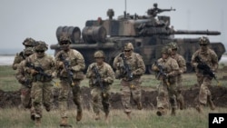 Soldiers from the U.S. 101 Airborne Division take part in NATO exercises near the Black Sea port of Constanta, Romania, on March 31, 2023. 