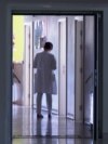 Bijeljina, Bosnia and Herzegovina -- A doctor in a hallway of a hospital