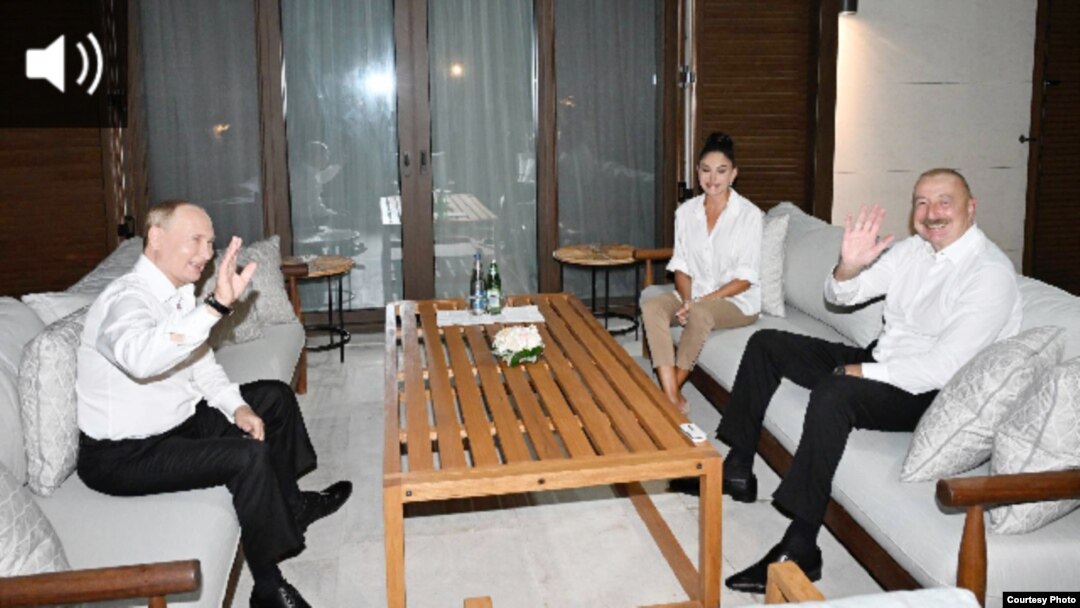 Visiting Russian President Vladimir Putin (left), Azerbaijani President Ilham Aliyev (right) and his wife Mehriban Aliyeva in Baku, August 19.