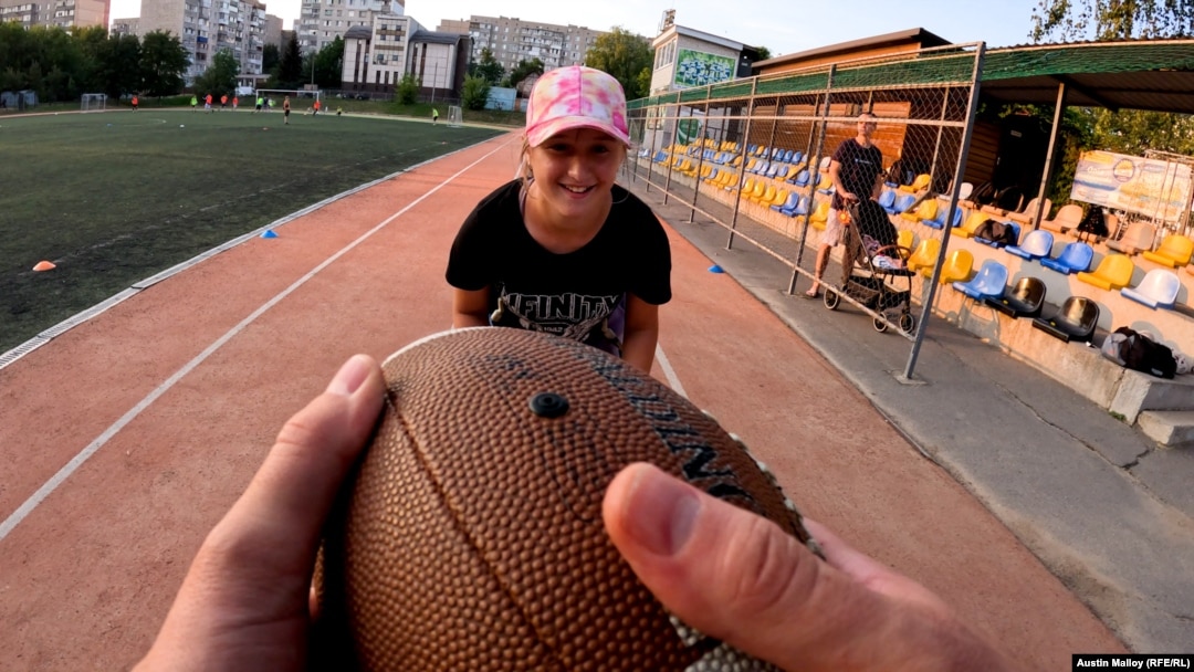 Twelve-year-old Polyna Bezkorovayna does football drills during an evening practice with her new team, the Vinnytsya Wolves.