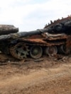 A destroyed Russian tank lies in the village of Novodarivka after Ukrainian forces retook the settlement in the Zaporizhzhya region from invading Russian troops in July 2023. 