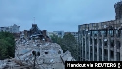 Общий вид зданий, поврежденных в результате российского ракетного удара по жилому дому во Львове, Украина, 6 июля 2023 года
