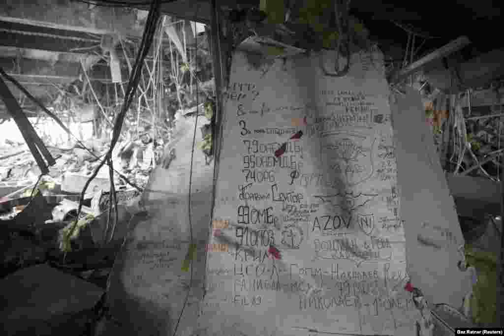 Graffiti left by Ukrainian fighters is seen inside the airport in March 2015. From 2015 the airport became a frontline site between Ukrainian and Russian-backed forces and a symbol of the ruination of the largely static trench conflict.