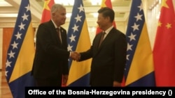Dragan Covic -- leader of Bosnia’s Croatian Democratic Union -- meets with Chinese leader Xi Jinping in Beijing in 2015 while he served as a member of Bosnia’s three-member presidency.