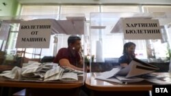Electoral workers collect paper ballots in Bulgaria's parliamentary election on April 2.