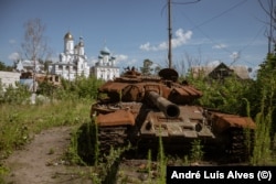 A burned T-72 tank is a reminder of the failed Russian attempt to cross the Siverskiy Donets River.