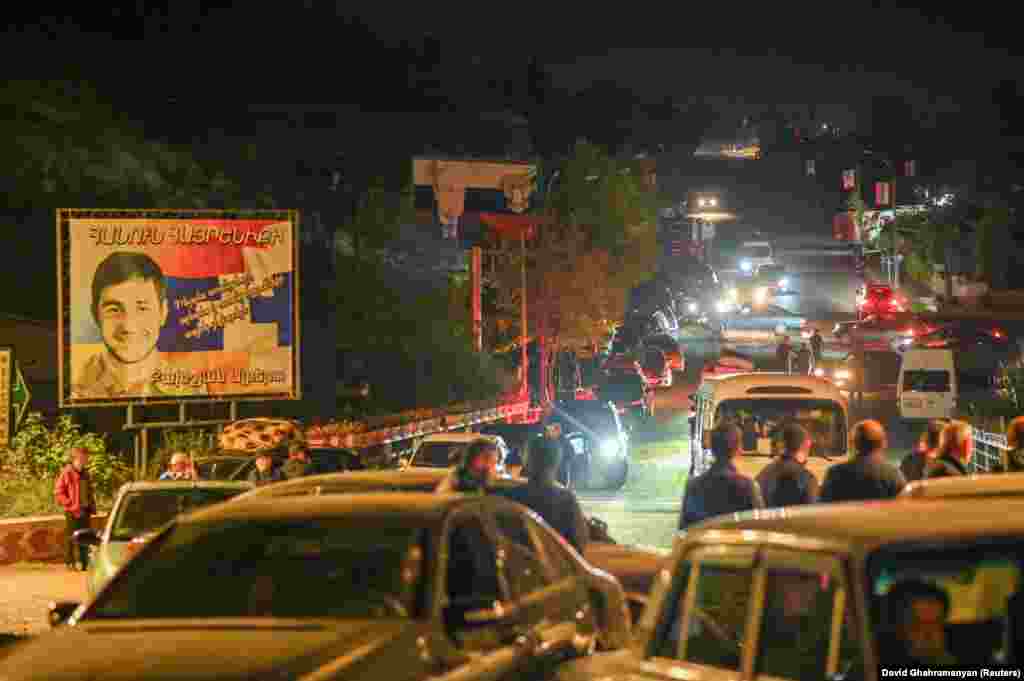 This was the scene late on September 24 as ethnic Armenians prepared to flee Nagorno-Karabakh past a billboard featuring the Russian flag, and Vladimir Putin. The photo was taken in the city known as Stepanakert in Armenian, and Xankendi in Azeri.&nbsp;