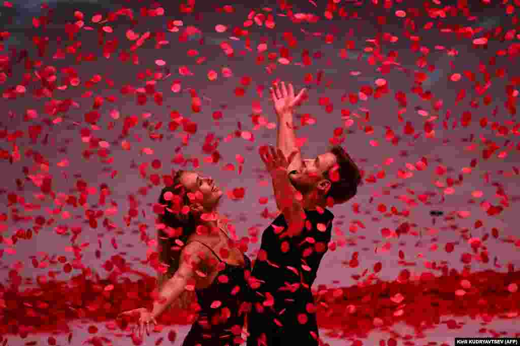 Russian figure skaters Victoria Sinitsina (left) and Nikita Katsalapov perform in a show at the CSKA arena in Moscow on February 14.