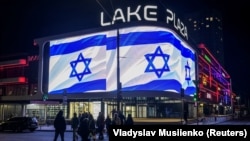 An Israeli national flag is seen on a screen at a shopping mall to support Israel in Kyiv on October 8.