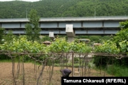 The new highway cuts through a small village.