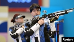 Alexandra Le (left) and Islam Satpayev have won Kazakhstan's first medal in a shooting event since 1996. 