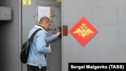 A Russian Army conscript is seen at an enlistment office.