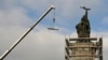 BULGARIA MONUMENTS -- A crane builds scaffolding around the statue of the Red Army monument during the start of the dismantling of the monument in Sofia, Bulgaria, 12 December 2023.