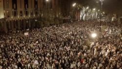 Thousands Protest, And Lawmakers Brawl, As Georgian "Foreign Agents" Bill Reappears In Parliament