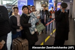 Kyrgyz nationals at an airport in Russia