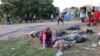 Жінка плаче біля тіл загиблих після удару в селі Гроза Харківської області 5 жовтня 2023 року.<br />
За останніми даними ДСНС, <a href="https://www.radiosvoboda.org/a/news-kharkivska-oblast-udar-rf-dsns/32624861.html" target="_self">у результаті російської атаки загинула 51 людина</a>, в тому числі 6-річний хлопчик