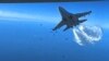 In the 43-second video clip, two Russian Su-27 jets can be seen dumping fuel as they fly close to the MQ-9 Reaper drone.