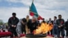 People take part in World War II Victory Day commemorations in the Kazakh capital, Astana, on May 9.