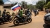 Supporters of a coup in Burkina Faso wave a Russian flag in October 222.