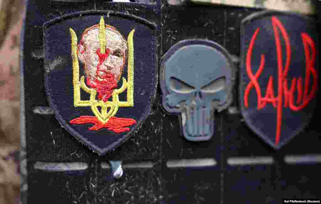 An image depicting Russian President Vladimir Putin&#39;s head impaled on a Ukrainian trident is seen on a patch worn by a soldier who had just returned from Bakhmut.